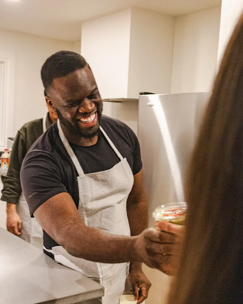 A barista serving with a smile